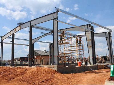 U.S. Sailors assigned to Naval Mobile Construction Battalion 11 construct a pre-engineered building for the technical trainer at the Naval Construction Battalion Center in Gulfport, Miss., May 8, 2013. (U.S. Navy photo by Mass Communication Specialist 1st Class Jonathan Carmichael/Released)